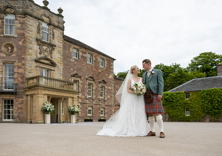 Bride and groom outside Archerfield House